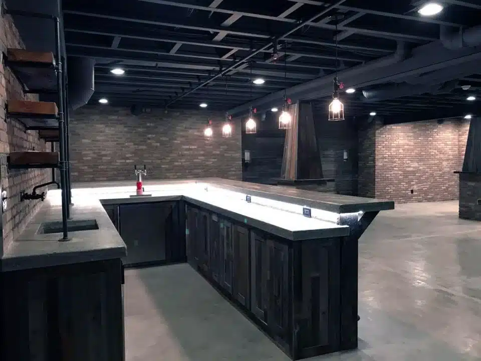 Full Basement Remodeling project with cement floors and bar installation